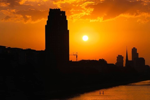 The sun sets behind the Mainplaza Hotel in Frankfurt am Main, Frankfurt am Main, Hesse, Germany,