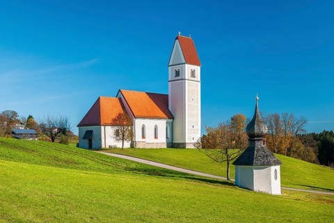The Gothic pilgrimage church of St Florian with the baroque fountain chapel, Frasdorf, Chiemgau,
