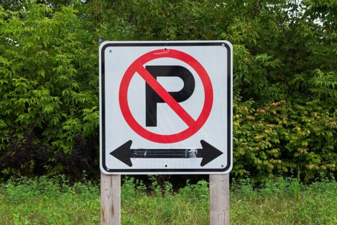 Large white, black and red No Parking with Left and Right direction arrows pictogram notice sign