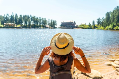 Woman tourist in the beautiful landscape at Mummelsee, Black Forest, Germany, Europe