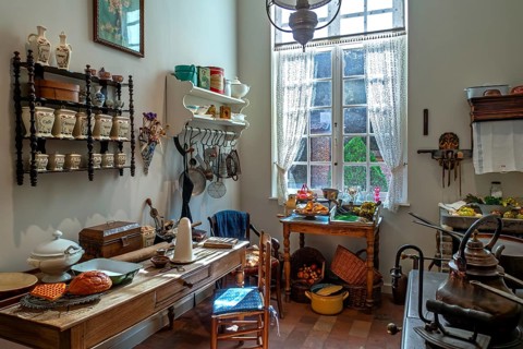 Kitchen inside 18th century clergy house, parsonage, rectory Schriek at recreated village in open