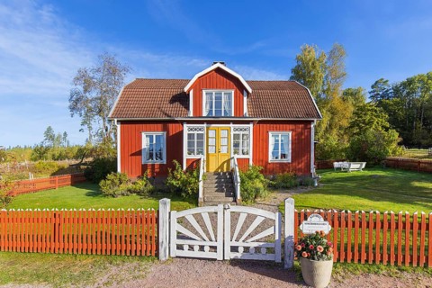 Katthult, red wooden farm house with fence from Astrid Lindgren's tales about Emil of Lönneberga at