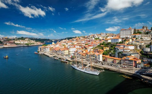 Aerial view of Porto city and Douro river with moored sailling ship from Dom Luis bridge I. Porto,