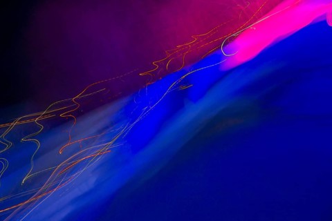 Abstract picture with neon-coloured light stripes in blue and pink on a dark background, art