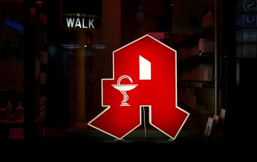 Night shot, logo, red neon sign, sign, pharmacy with Aesculapian staff, Aesculapian staff,