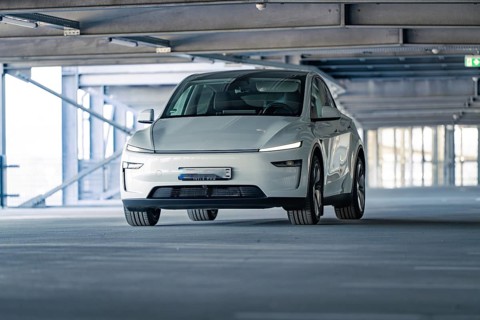 Electric car with modern shapes in a dimly lit car park, Tesla New Model Y Juniper, Calw, Germany,