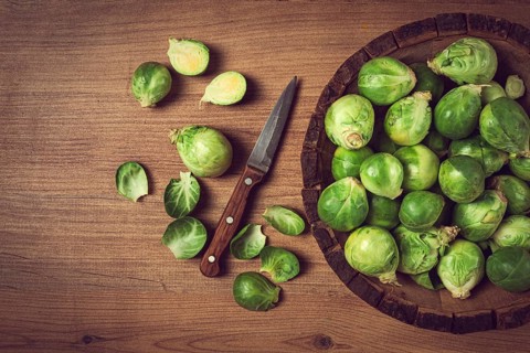 Fresh Brussels sprouts, raw, top view, on a wooden table, no people