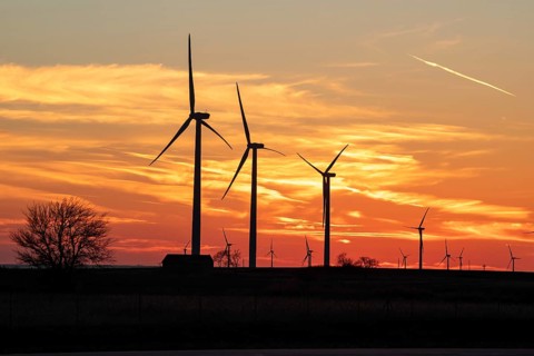 Wilson, Kansas - Wind turbines are silhouetted against the sunset in central Kansas.