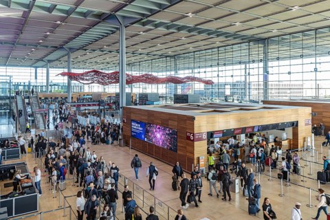 Berlin-Brandenburg BER Airport. Passengers in Terminal 1 waiting for check-in and security control