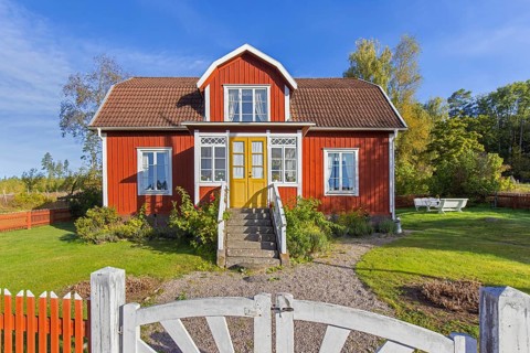 Katthult, red wooden farm house with fence from Astrid Lindgren's tales about Emil of Lönneberga at