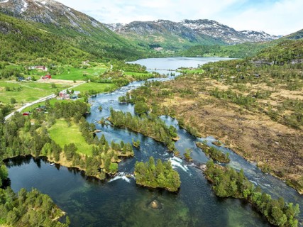Gaularfjell mountain crossing following river Gaula and chain of lakes, early spring, aerial view,