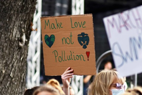 Heidelberg, Germany, 24th September 2021: Sign held up by young woman saying 'Not cool' at Global