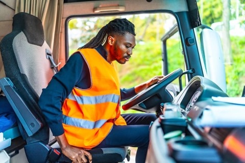 View from inside the vehicle of an african driver about to drive a distribution truck