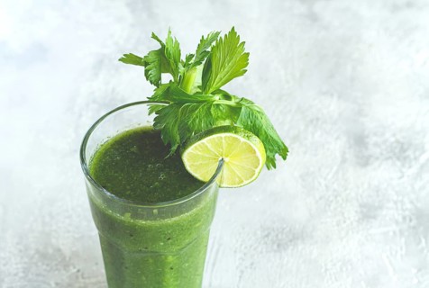 Glass with green smoothie, celery and spinach, apple and kiwi, cucumber, vegetable smoothie,
