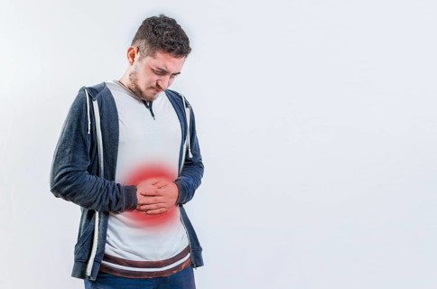 Unhappy man with digestive problems isolated. Person with digestive and stomach problems isolated