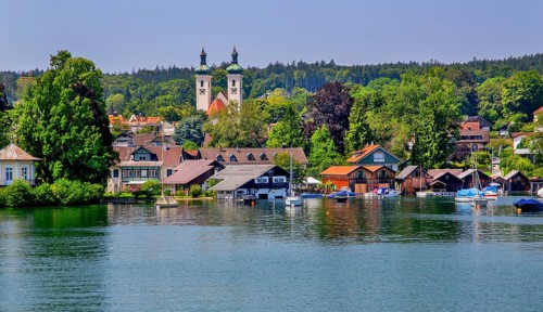 Waterfront with boathouses and towers of the parish church, Tutzing, Lake Starnberg, Bavarian
