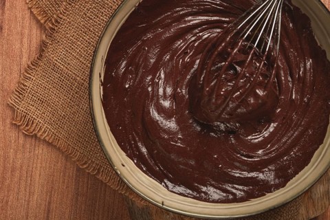 A bowl of chocolate dough, a whisk for whipping, baking, structure and consistency, homemade, top