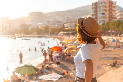 Portrait of a tourist woman at sunset in Sarande or Saranda on the Albanian riviera, Albania,