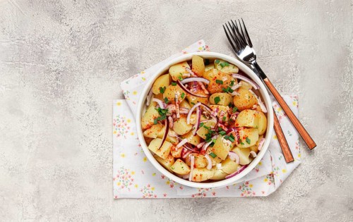 Boiled potato salad with red onion, German cuisine, homemade, no people