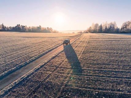 A vehicle on a frost-covered road in the rural sunrise, car sharing, electric car, Volkswagen ID 5,