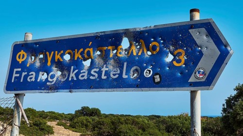 Road sign, bullet holes, shot up road sign, Frangokastello, Venetian fortress, fortress, Sfakia,