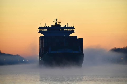 Container ship sailing at sunrise and fog in the Kiel Canal, NOK, Kielkanal, Kiel Canal,