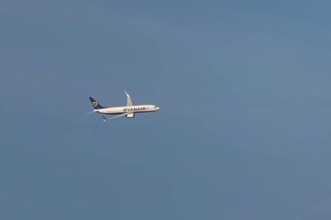 Boeing 737 jet passenger aircraft of Ryanair flying in a blue sky, Rome, Italy, Europe