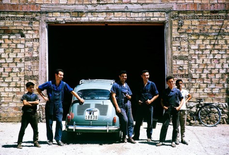 Mechanics standing next to a SEAT 600 car, Spain 1964