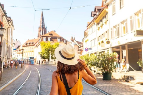 Walking past the Freiburg Minster in the city of Freiburg im Breisgau, Germany, Europe