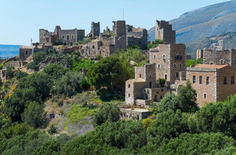 Detailed view of historic stone houses of a hilltop village, residential towers, Vathia, Ithylo,