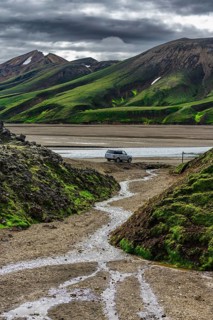 Off-road vehicle in volcanic landscape, Moss-covered mountains, Rhyolite mountains, Volcanic