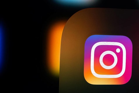 A close up of an iPad screen displaying the instagram app icon