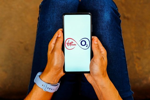 In this photo illustration, the Virgin Media O2 logo is displayed on a smartphone screen