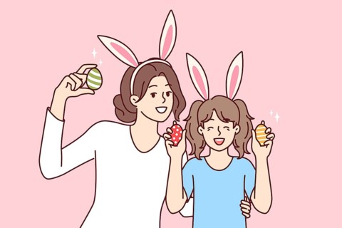 Easter eggs in hands of happy mother and daughter with bunny ears, to celebrate traditional