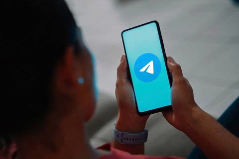 In this photo illustration, the Telegram logo is displayed on a smartphone screen