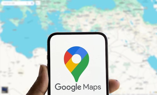 Google maps logo is displayed on smartphone