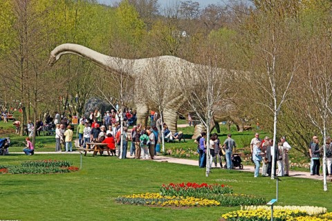 Visitors, dinosaur statue, Tulip Festival, garden show, Kaiserslautern, Rhineland-Palatinate,