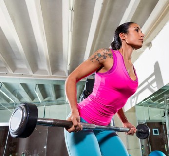 Barbell bent over row supine grip woman workout at gym exercise