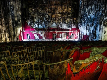 Abandoned and burned cinema hall in an old multiplex cinema