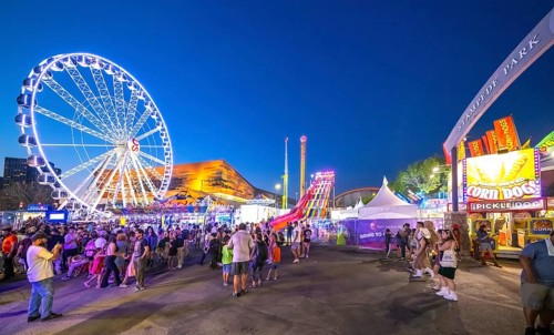 Calgary, Alberta, Canada. Jul 22, 2024. A vibrant evening at Stampede Park, featuring a brightly