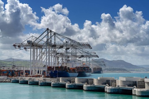 Tangier, Morocco, 1 April, 2024: container ships being unloaded and loaded at Tanger Med port in