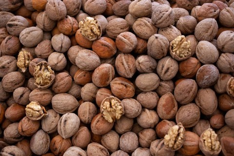 Whole walnuts background. Healthy organic food concept