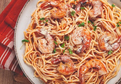 Spaghetti with tiger prawns, in tomato sauce, homemade, top view, no people