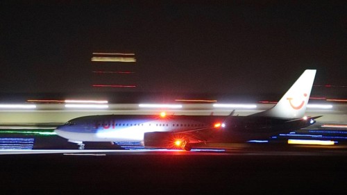 TuiFly Boeing 737 landing at night at Stuttgart Airport