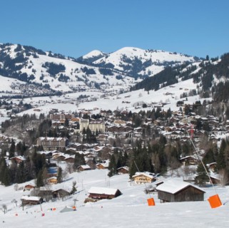 Ski slope and view of Gstaad in winter