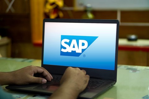 SAP SE logo is displayed on smartphone. SAP SE is a German multinational software company based in