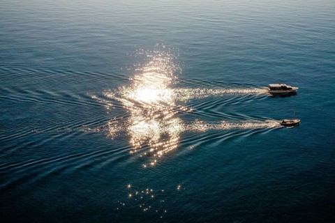 Boats in the glittering sea, near Dubrovnik, Dalmatia, Croatia, Europe