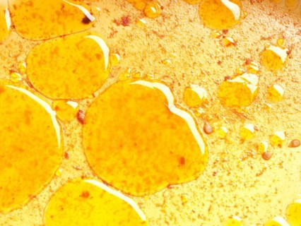 Close up of grease eyes in the baking dish using as background