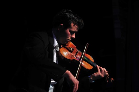 Violinists performing in live concert