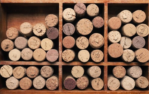 Bottle cork in a wooden box using as background or header, wine concept